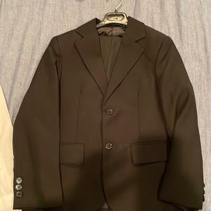 Black suit boy size 5-6. Blazer and pants used once for funeral.
